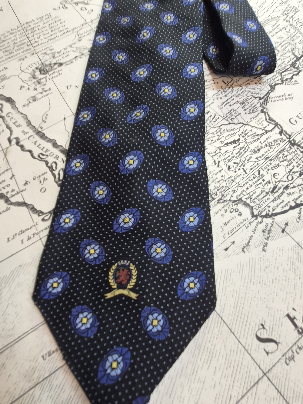 Tommy Hilfiger Black Tie with Blue Floral Medallions and Gold Crest